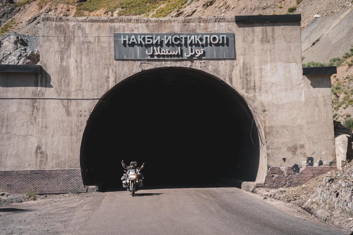 The Ansob Death Tunnel in Tajikistan, crossing it on our 3rd travel anniversary