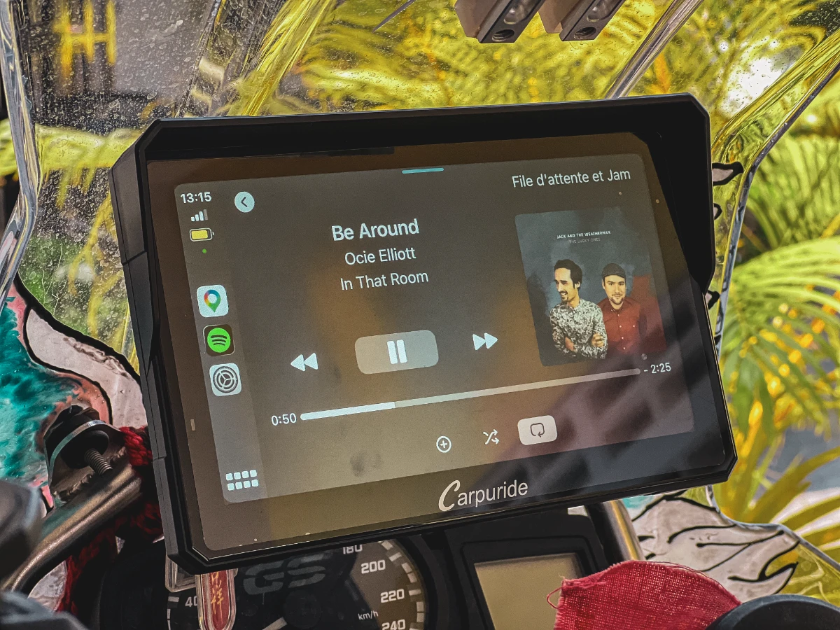 Carpuride W702 Pro 7-inch screen showing Spotify, crystal clear and easy to read