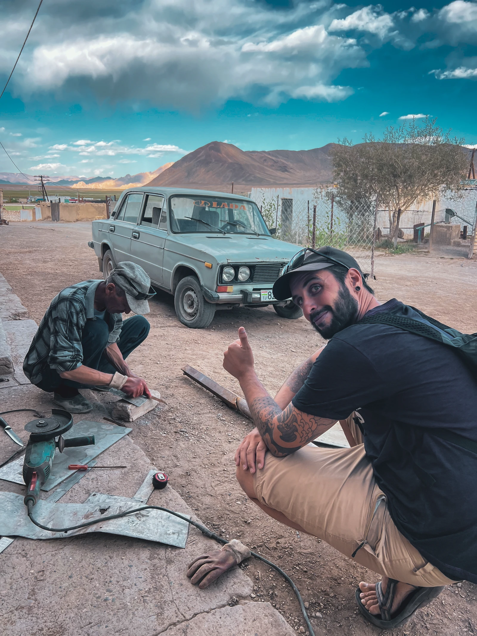 Making a fake license plate with a craftsman in Murghab, Tajikistan