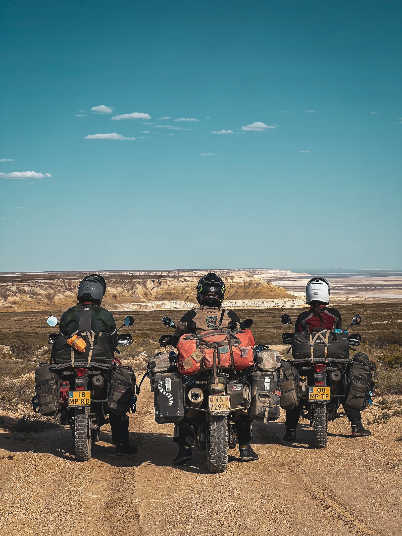 Four bikers looking out over Mangystau road