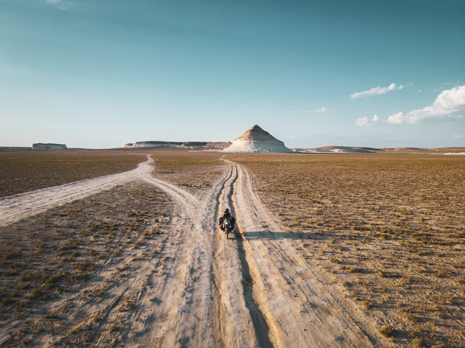 Alone in the middle of the Mangystau Desert on a motorcycle