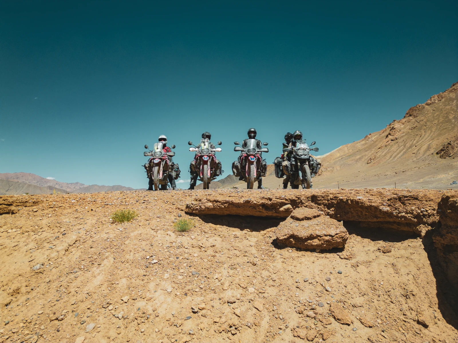 Drone shot of the motorcycle crew on the Pamir Highway before Murghab