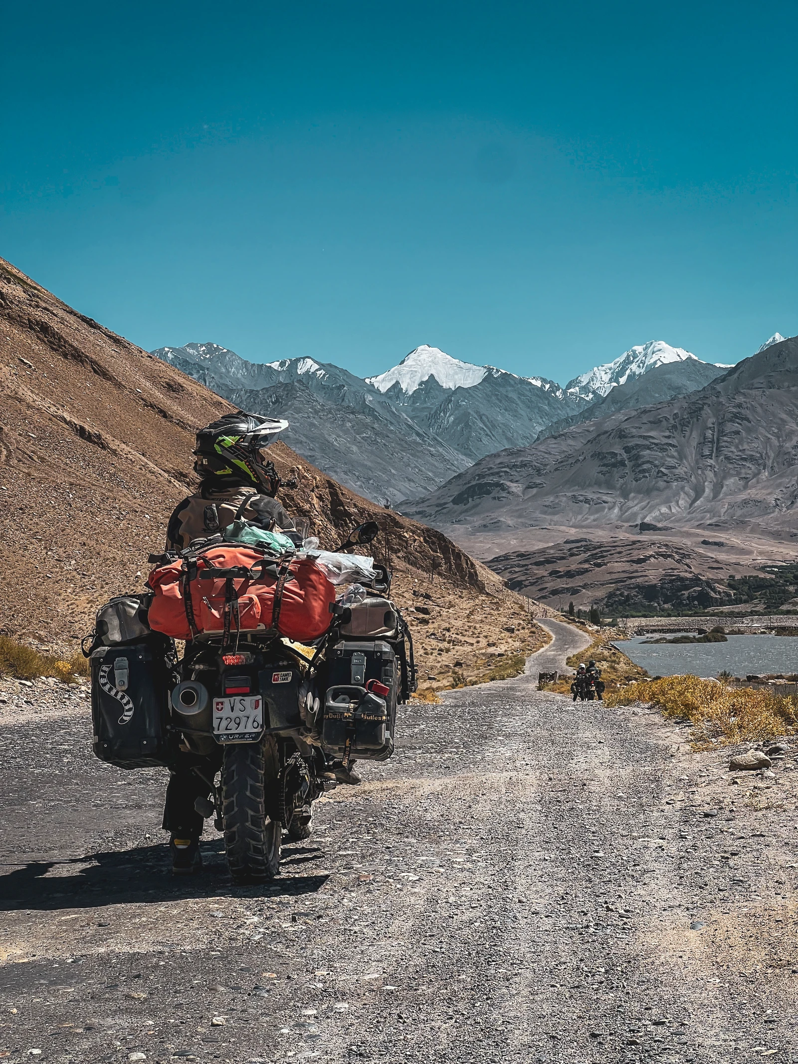 Snow-capped mountains in the distance, riding toward Lenin Peak in Kyrgyzstan