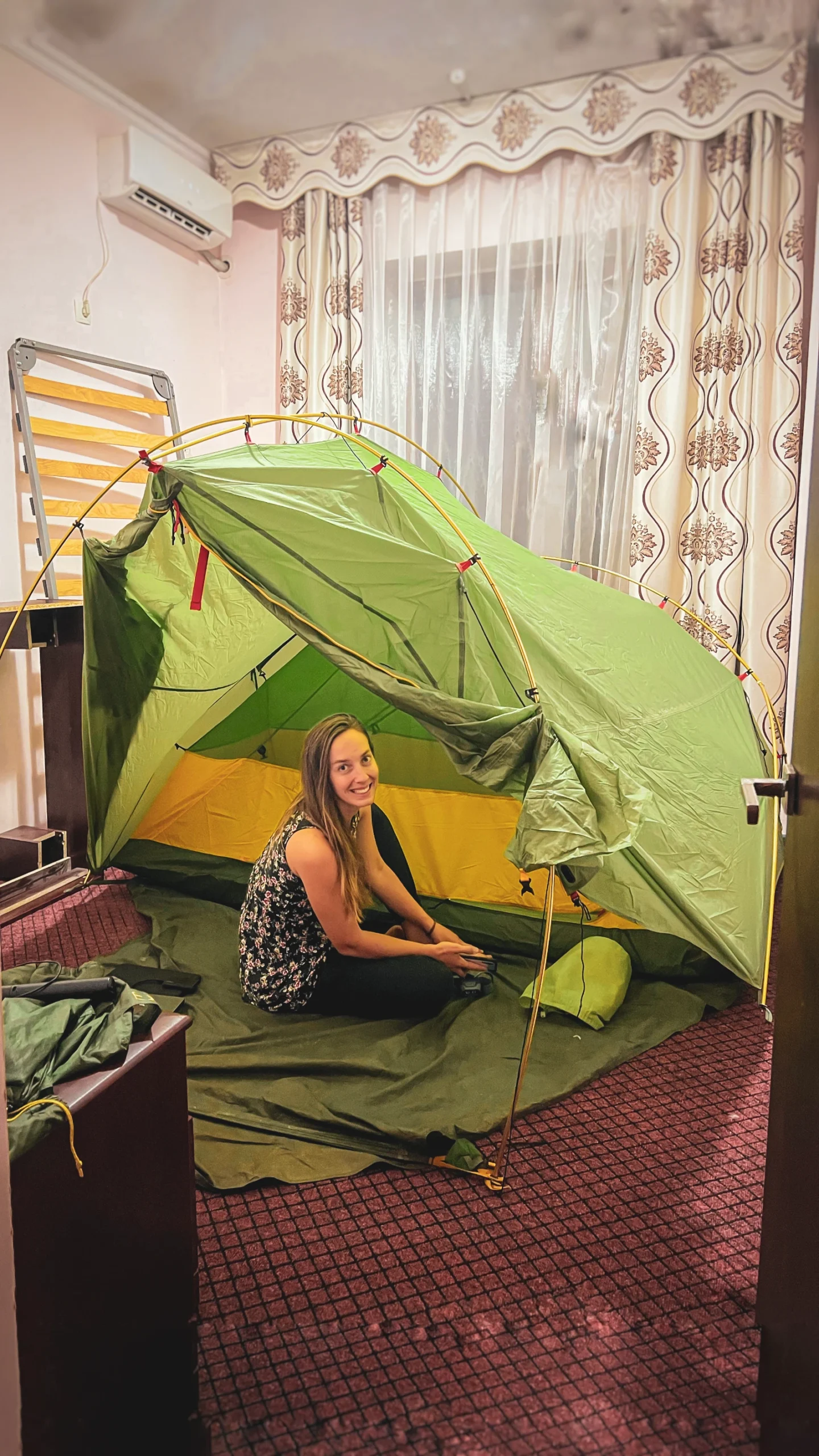 Pitching tent inside hostel room in Béïnou Kazakhstan to escape mosquitoes