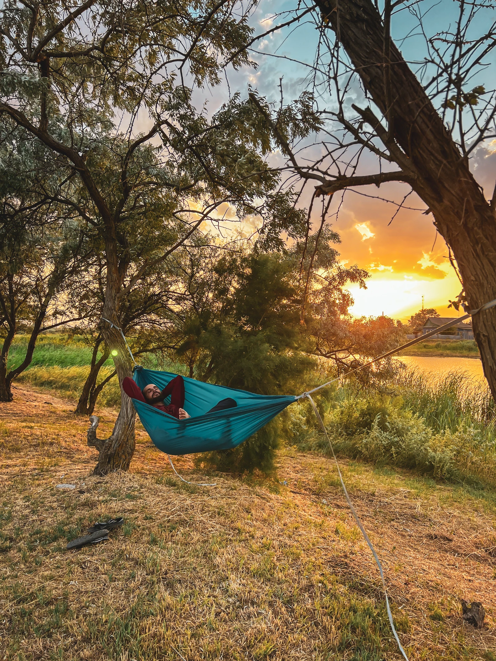 Hammock camping setup during the Russia motorcycle transit