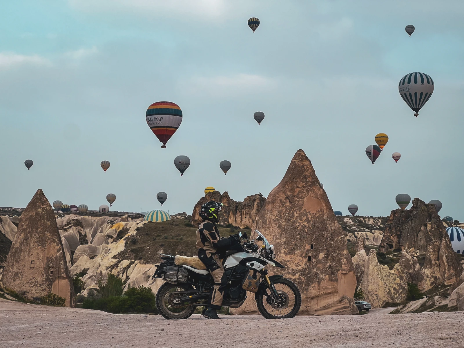 Turkey by motorcycle highlight: riding beneath hot air balloons in Cappadocia