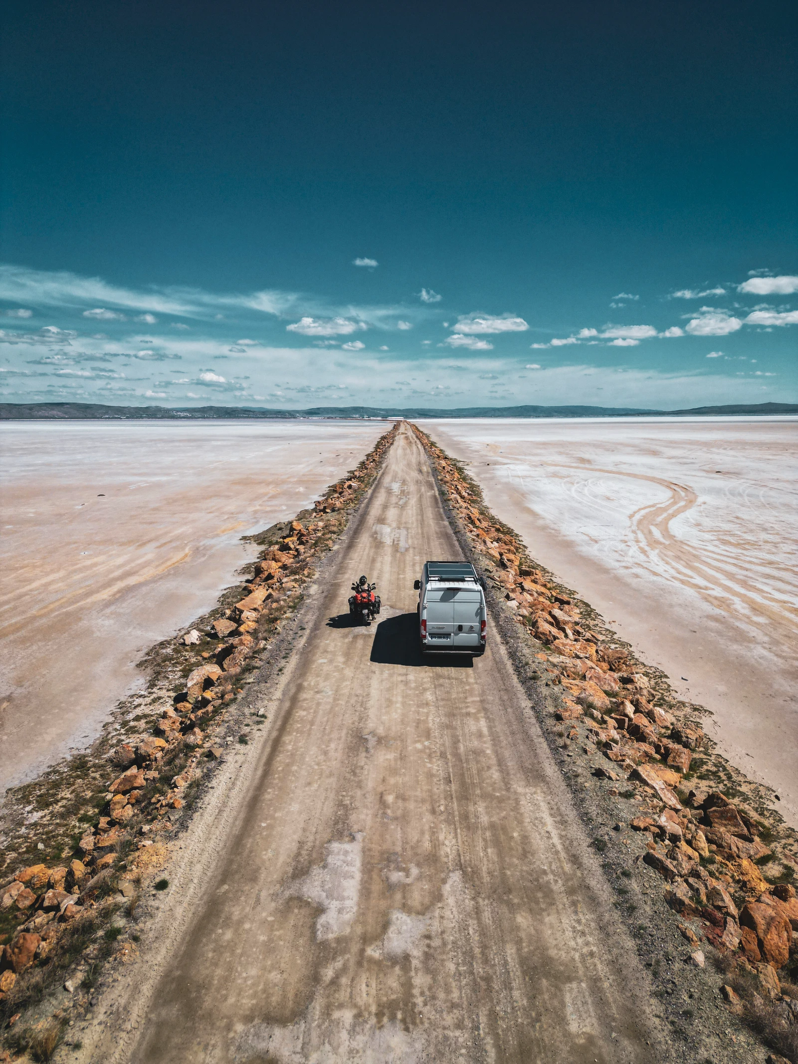 Gravel road crossing Lake Tuz, Turkey by motorcycle