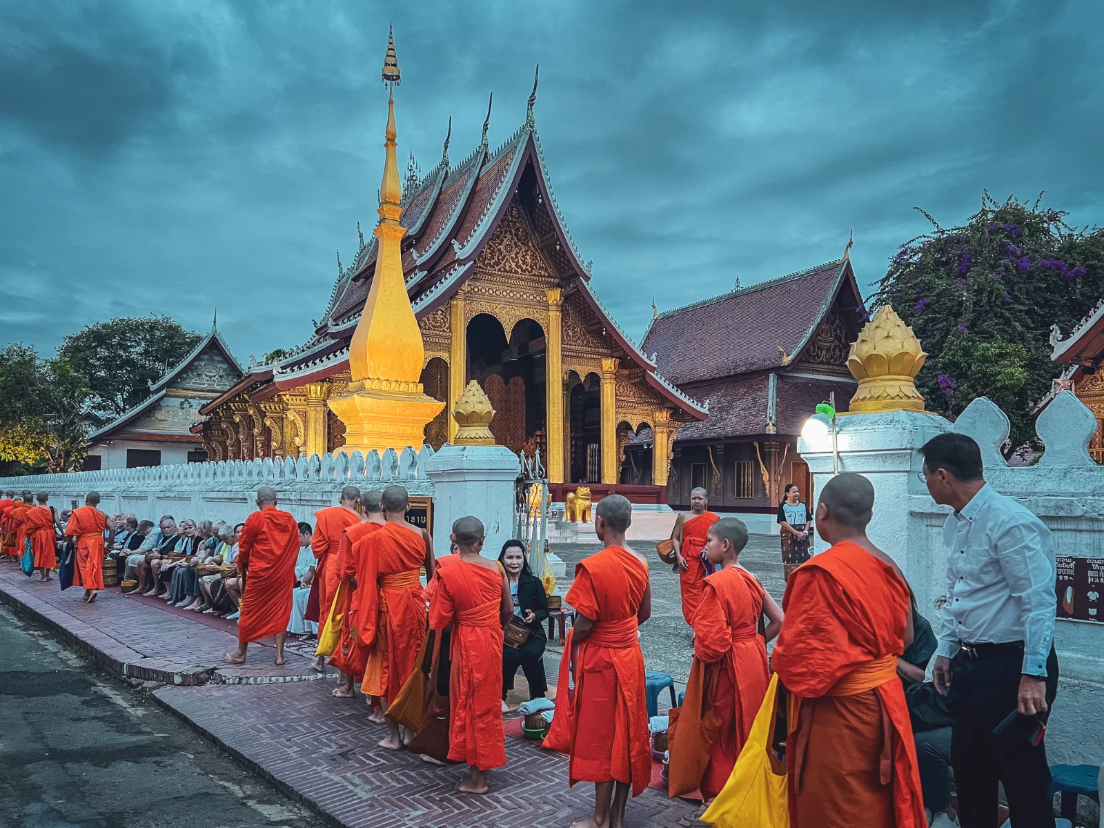 motorcycle travel Luang Prabang monks alms ceremony Laos