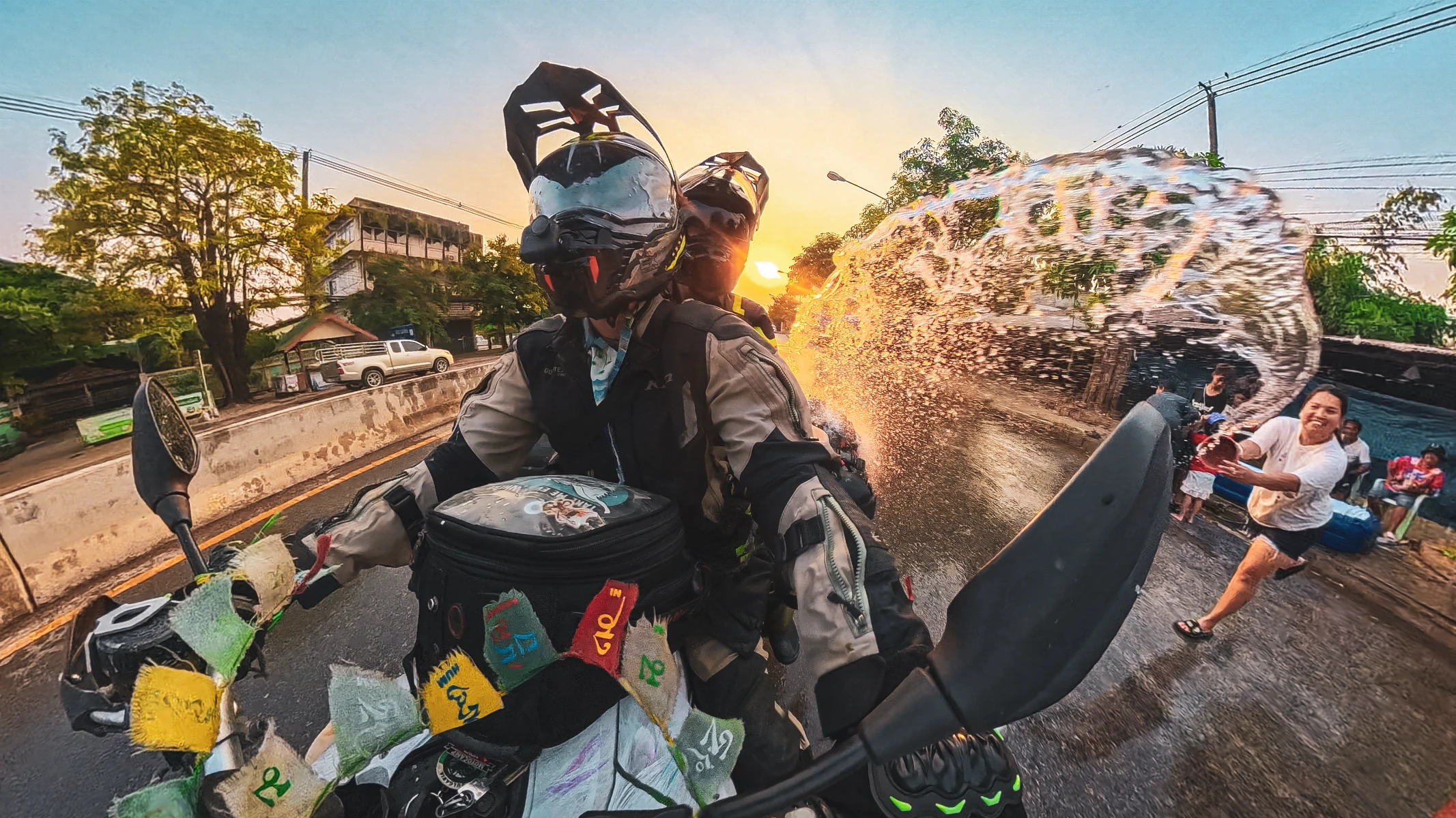 motorcycle travel Songkran Thailand Falkor water fight streets