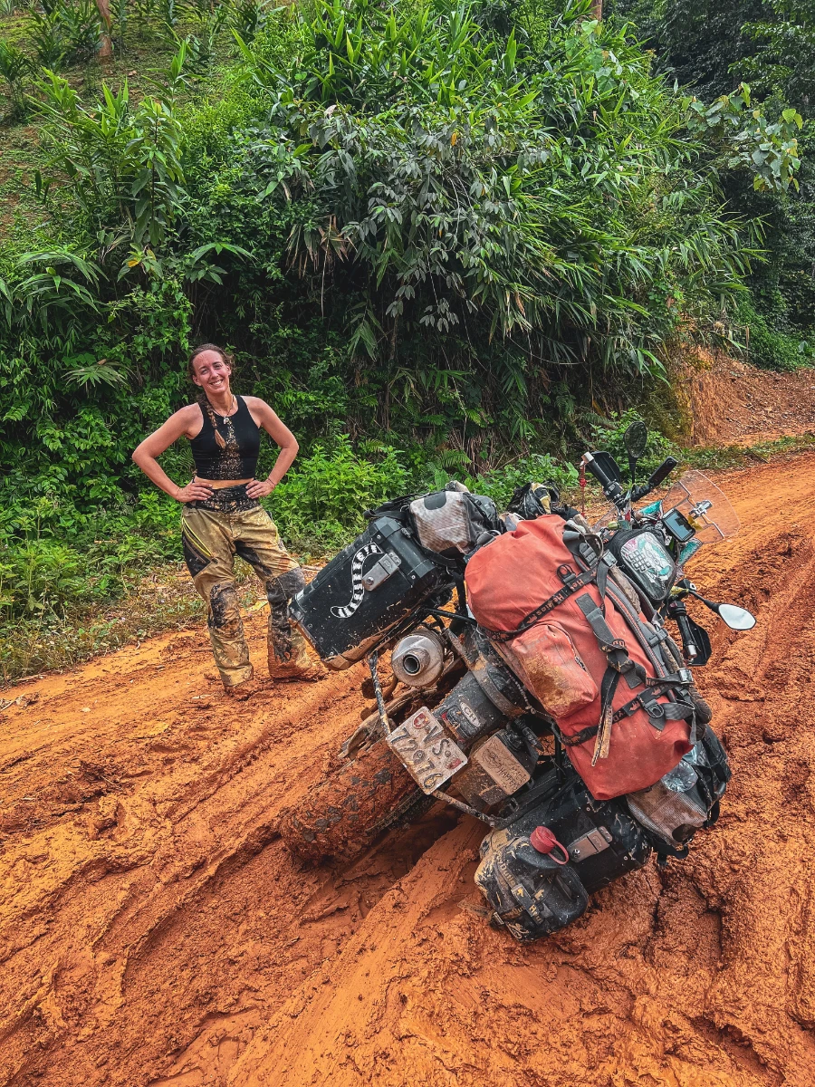 motorcycle travel Laos muddy offroad track Falkor stuck